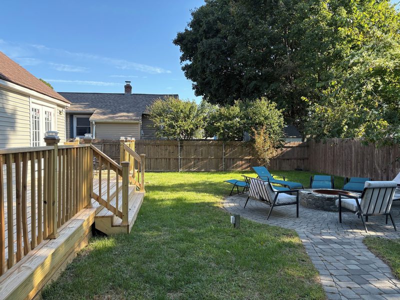 Backyard with fire pit and patio at our Cranston home